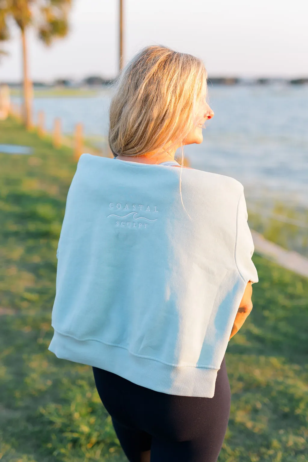 Coastal Sculpt embroidered crewneck draped over the shoulders